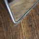 Simple rectangular barber mirror with a stand.