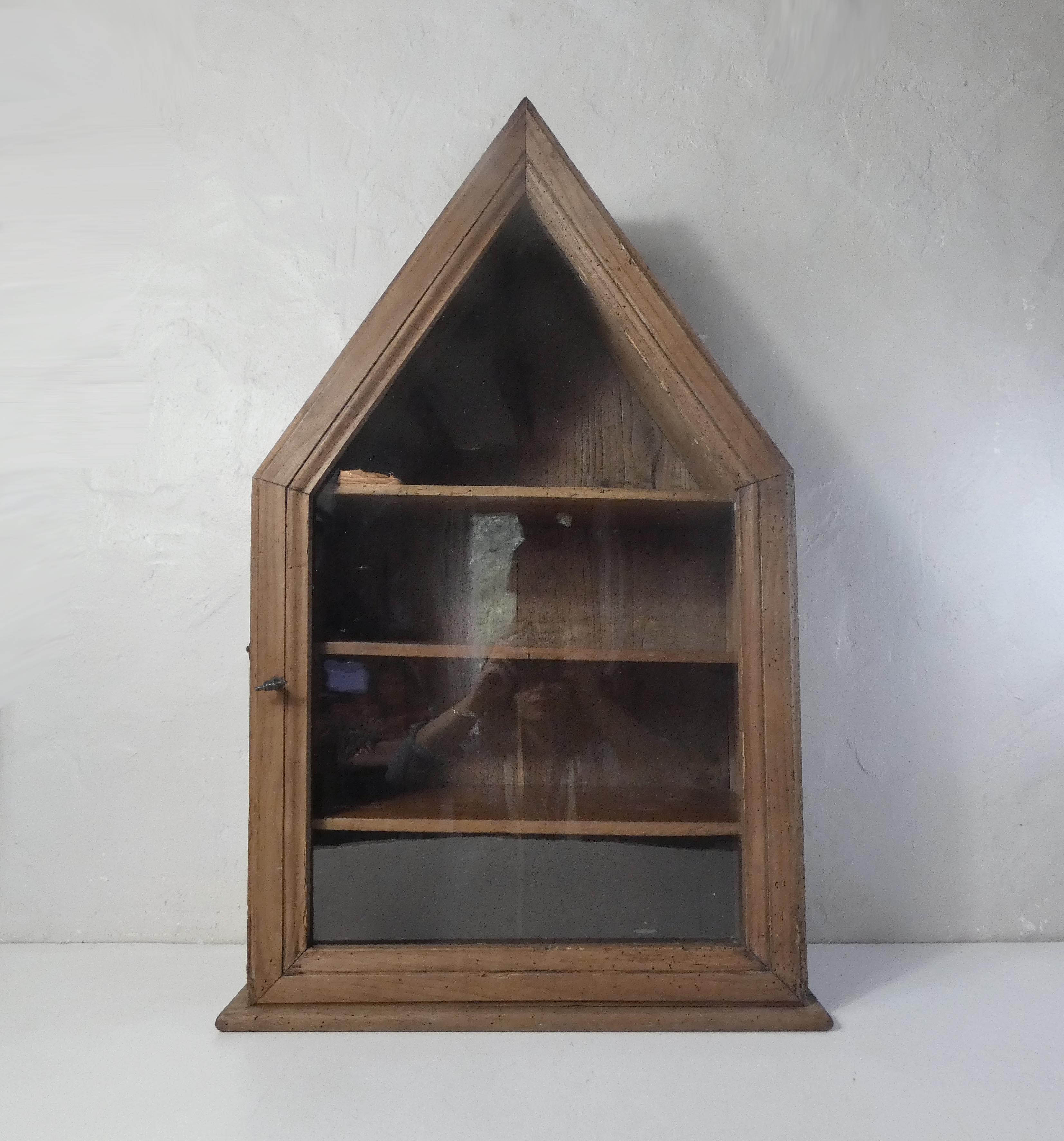 Old niche shelf with glazed statue