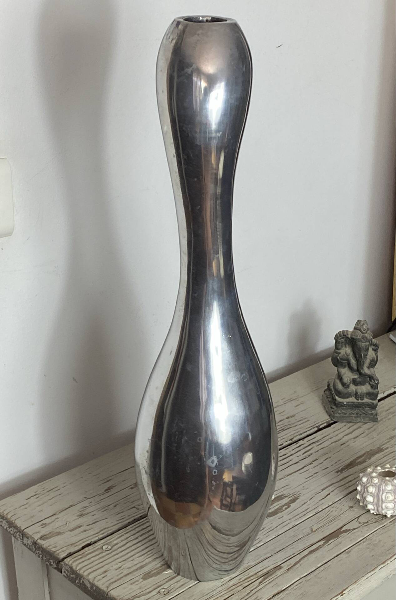Large organic vase in polished aluminium cast.