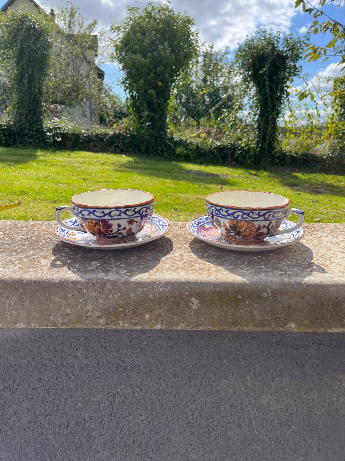 Gien earthenware tea cups and saucers with peony decor