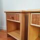 Pair of vintage bedside tables in wood and rattan.