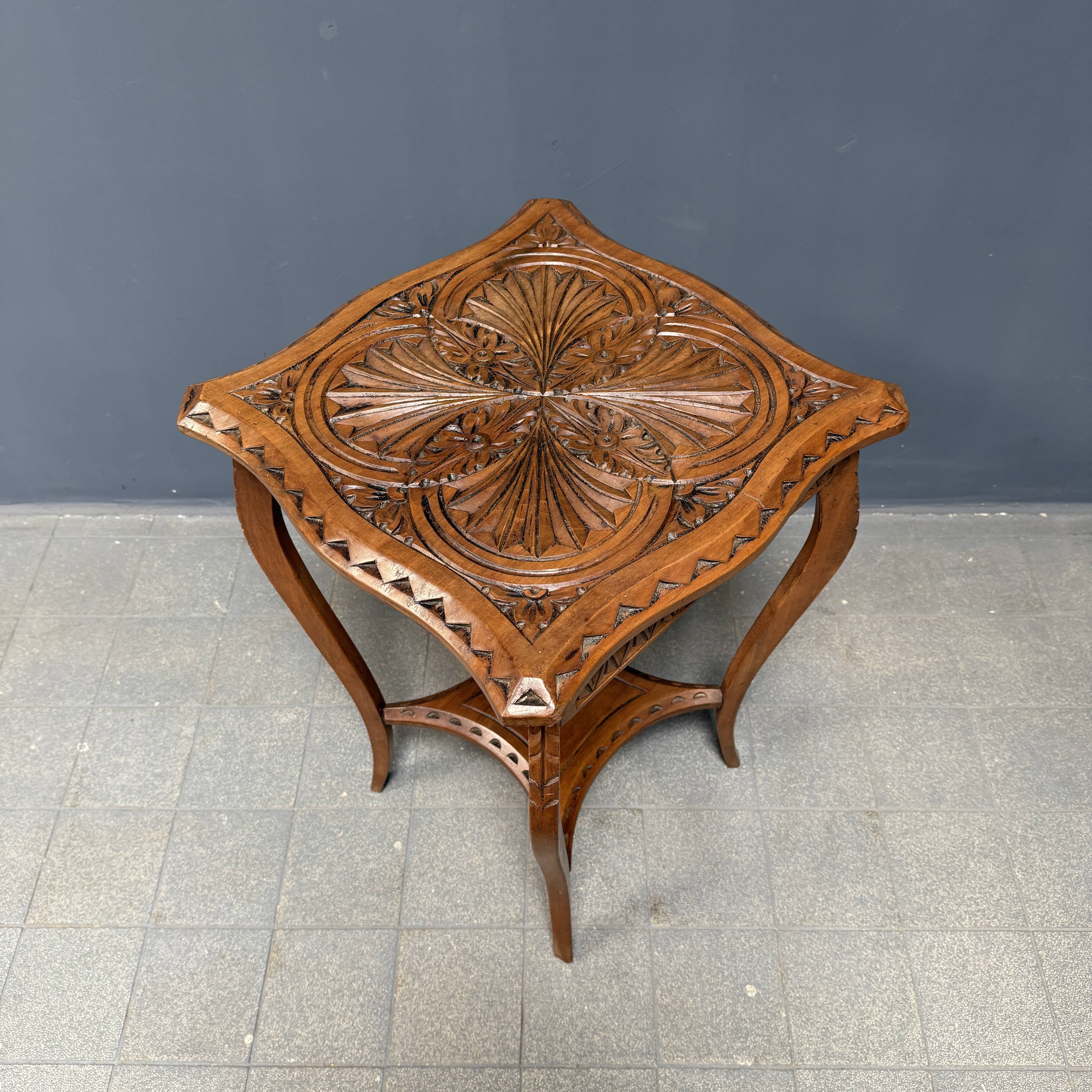 Graceful antique carved wooden side table