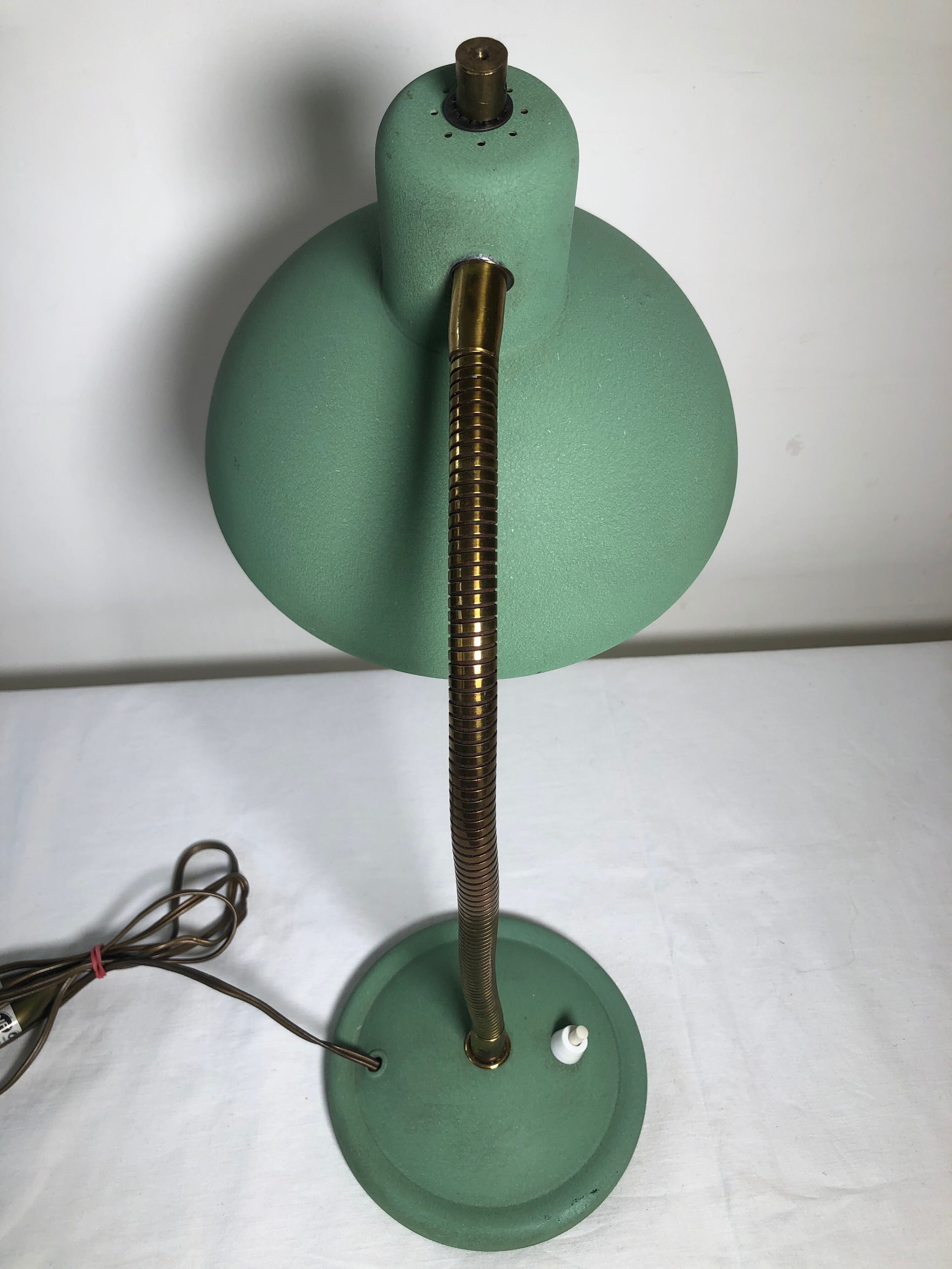 articulated desk lamp, vintage 50-year-long metal lamp. Good condition.