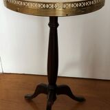 Wooden pedestal table on marble