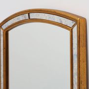 Mirror by Deknudt with marbled fume glass side panels in gilded wooden fram