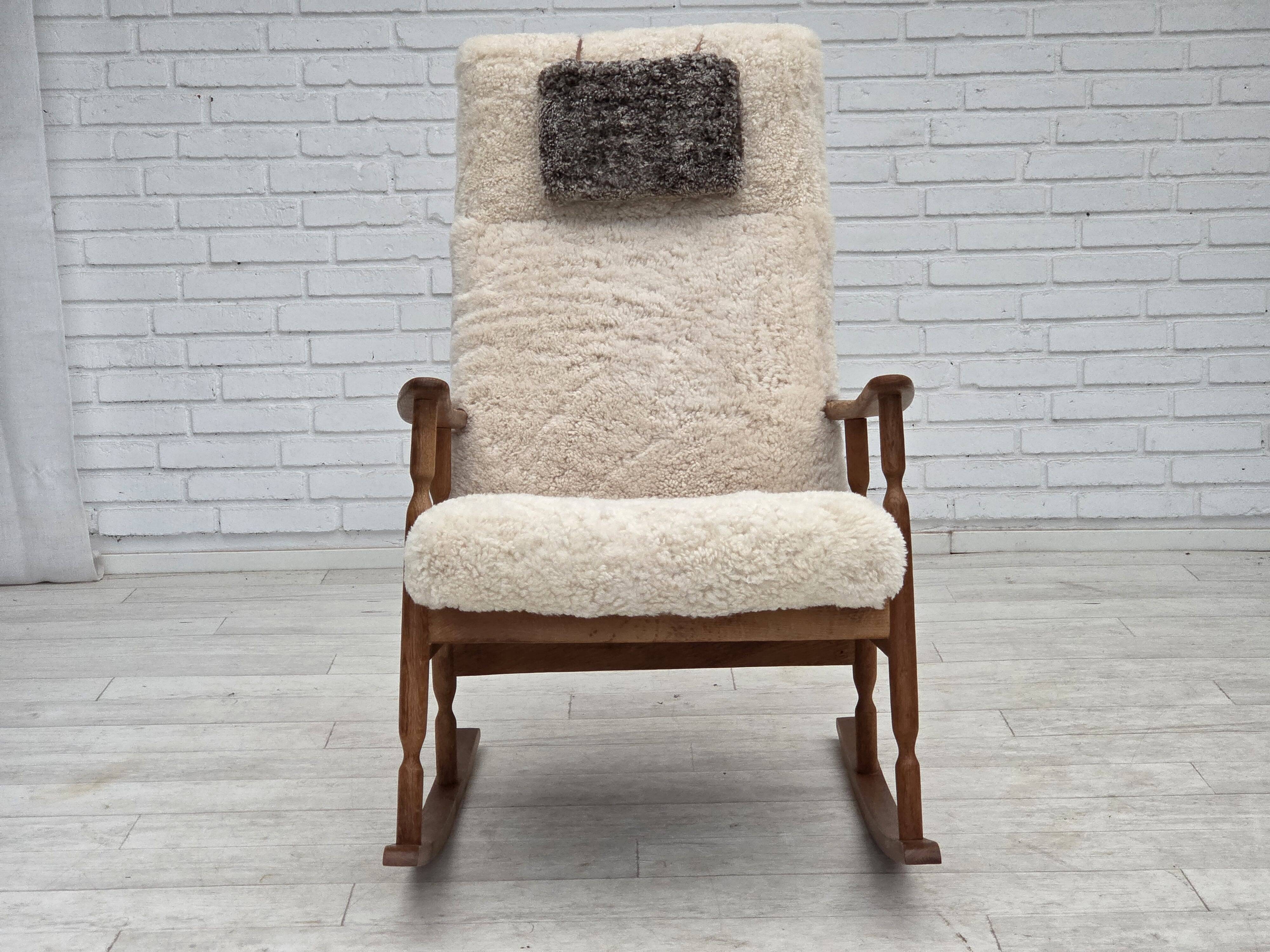 1970s, Danish rocking chair, reupholstered in quality genuine sheepskin.