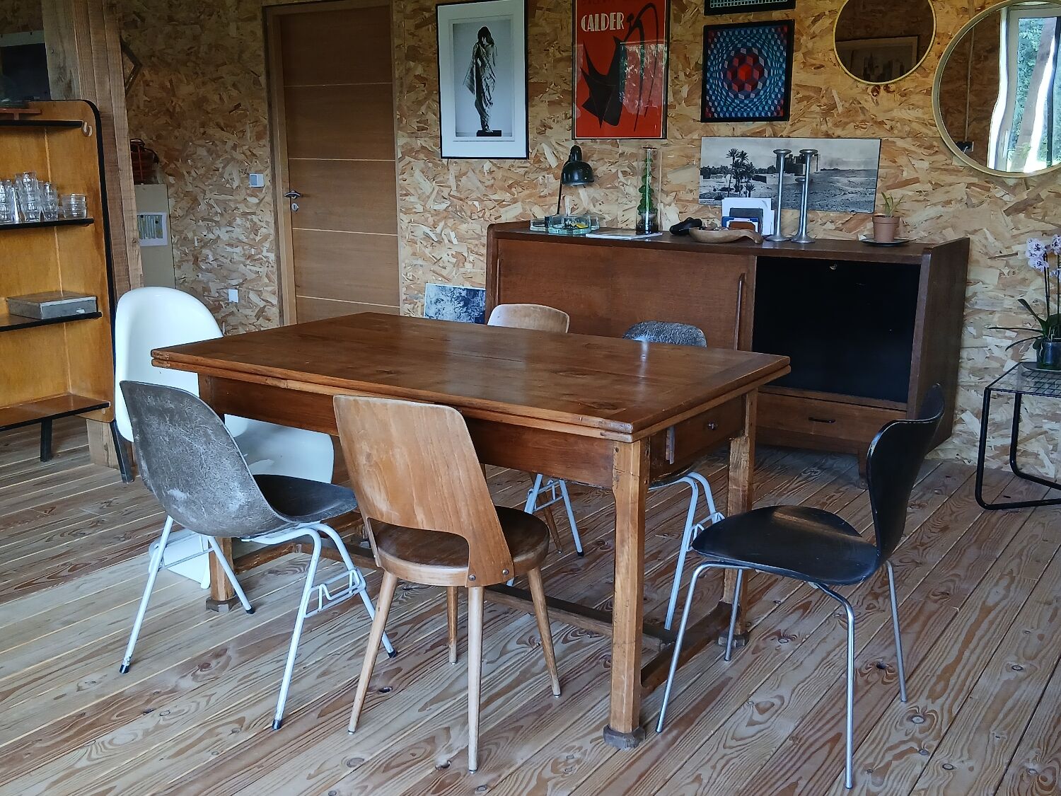 Elm farmhouse table with extensions for 6 to 10 people.