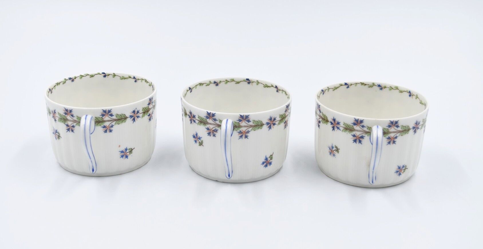 Three cups and under porcelain tea cups from Limoges Haviland barbed-wire décor