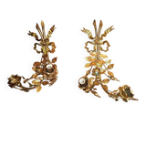 Pair of bronze and gilded metal wall sconces in the Louis XVI style.