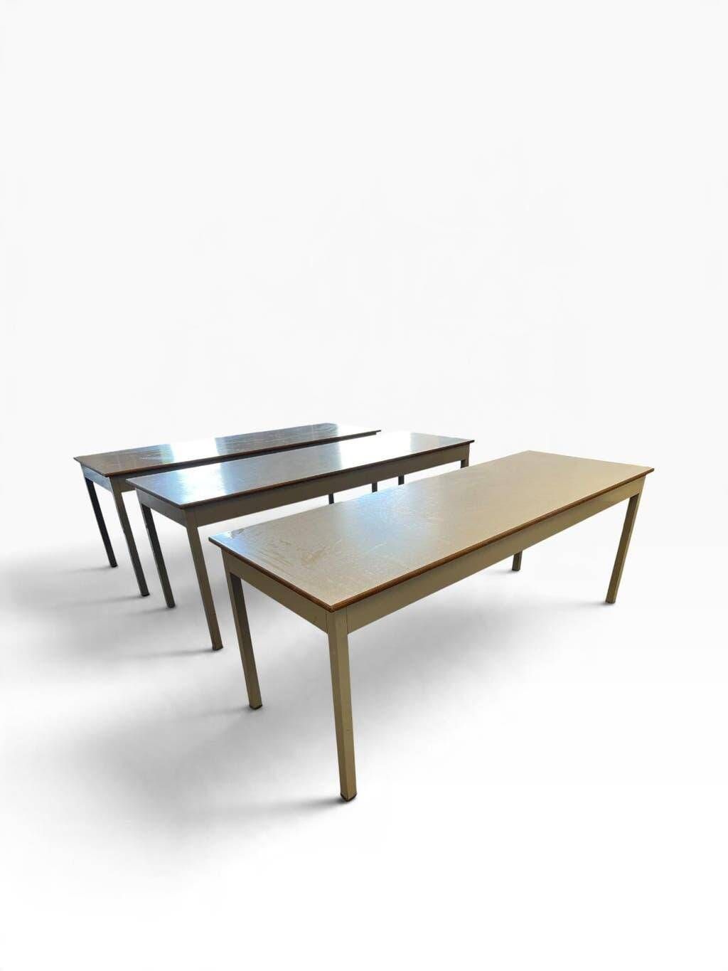 Vintage industrial table with a Formica top and wooden accents.