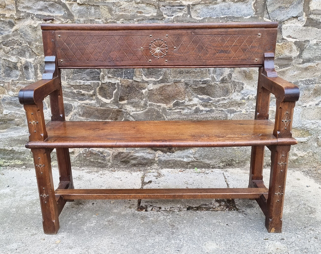Stylized church pew, early twentieth century, solid wood