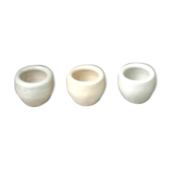 Set of old pots in beige sandstone