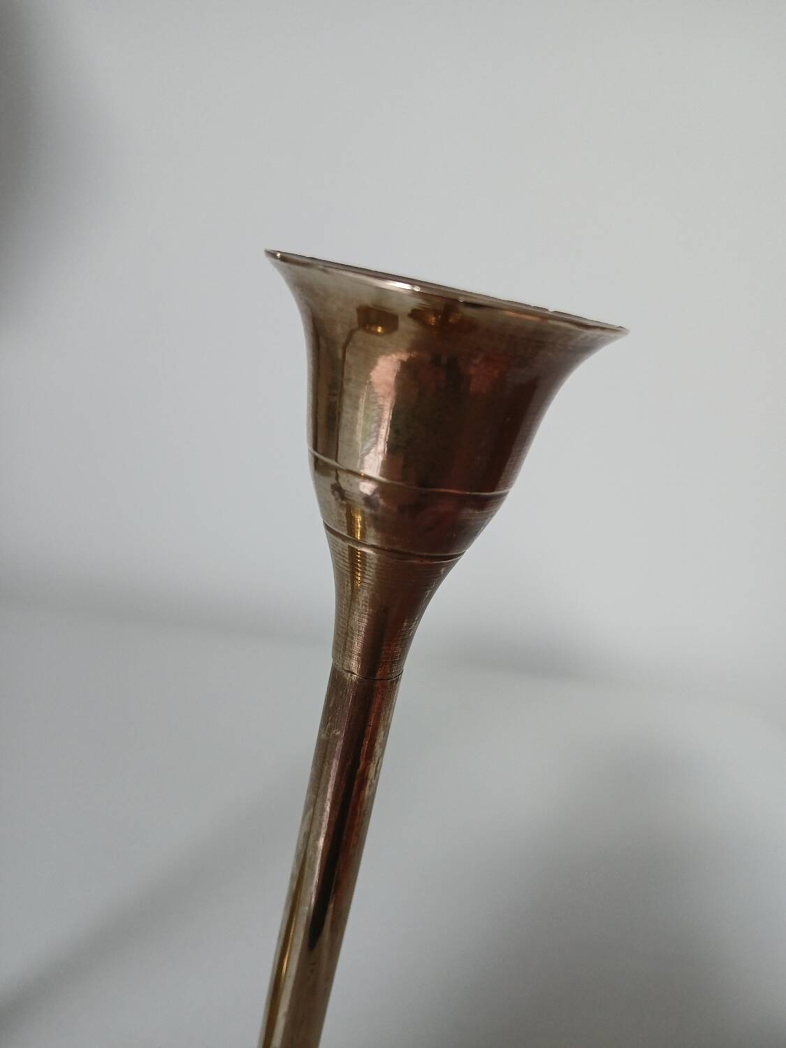 Set of two straight brass candlesticks.