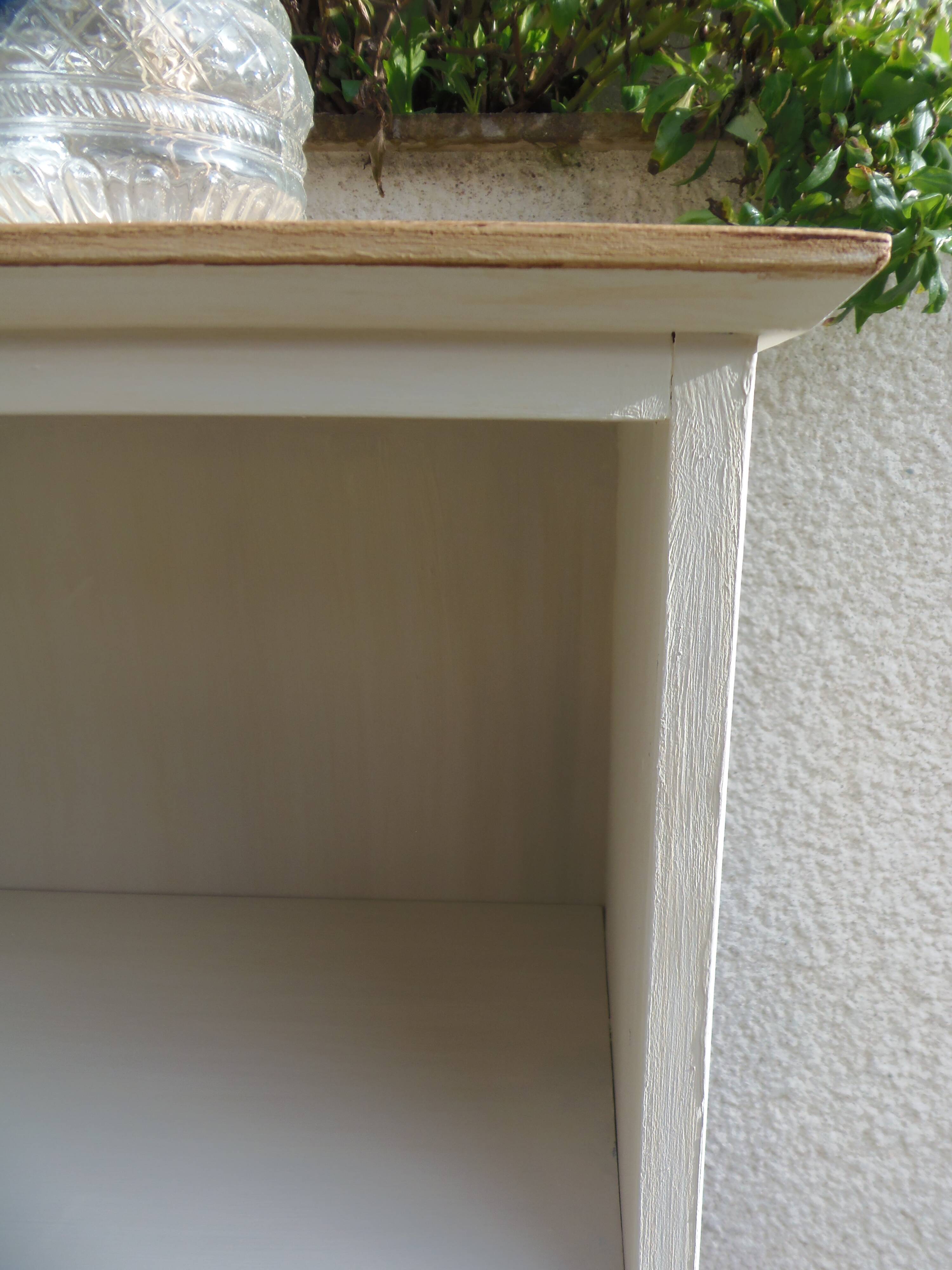 Vintage library enhanced in beige, wooden top.