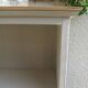 Vintage library enhanced in beige, wooden top.