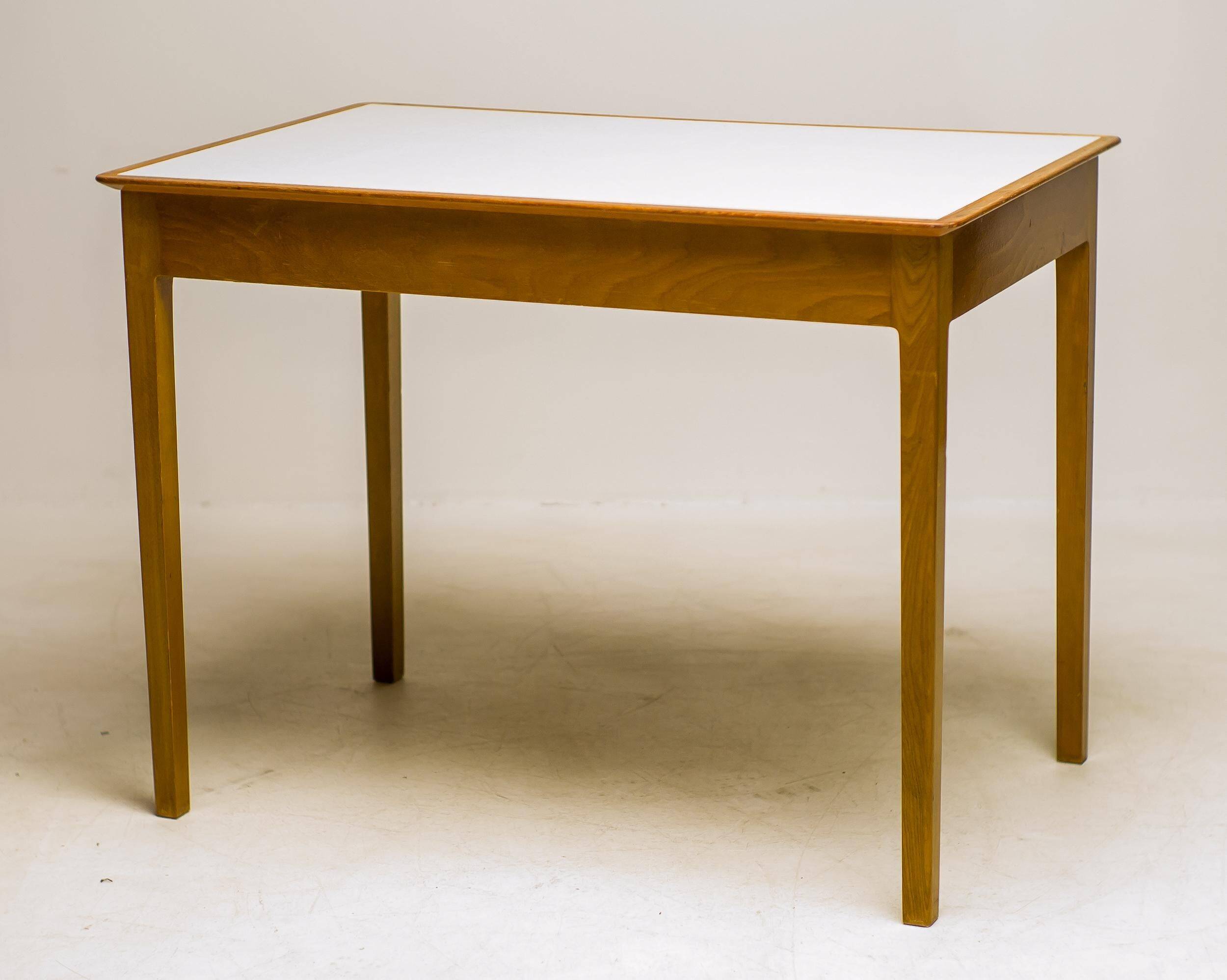 Small maple desk with a laminate top and two drawers, Fritz Hansen, 1950s.