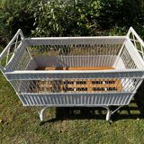 Vintage wicker bed with casters from the 50s in perfect condition
