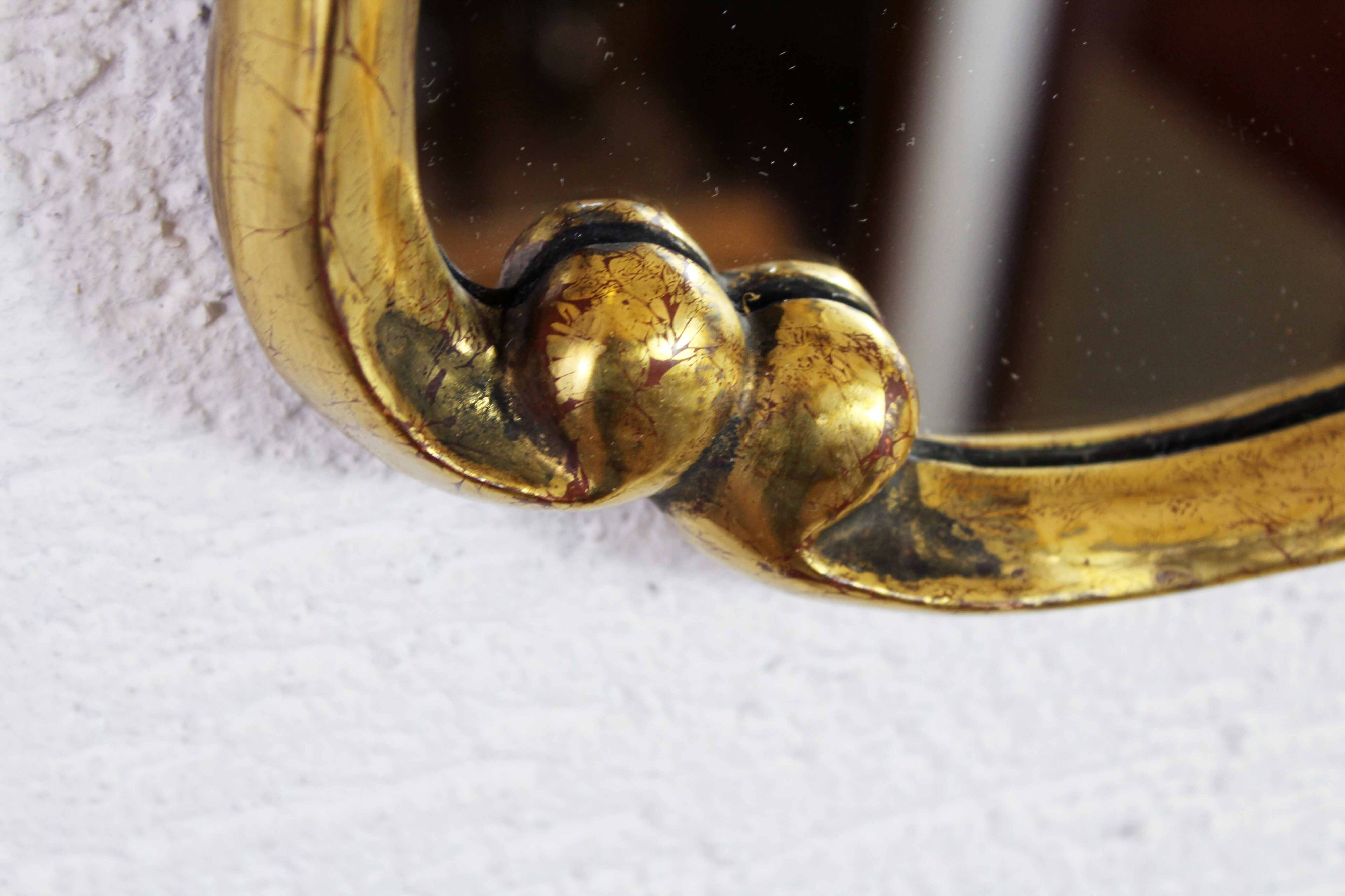 Mirror in gilded wood with leaf