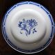 A set of 4 flat plates in pink and blue with Fontanges flowers from Sarreguemines.