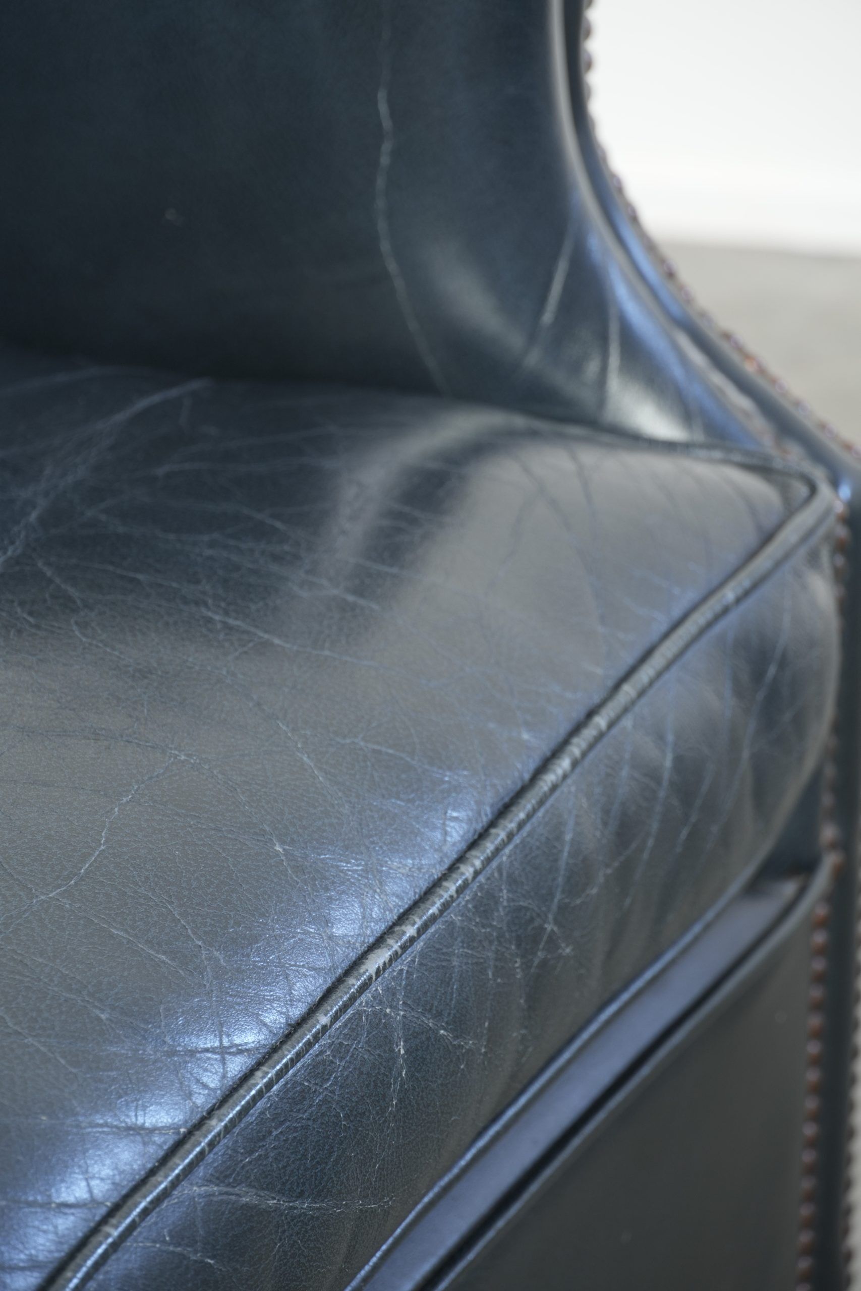 Set of dark blue cow leather club armchairs with a unique design