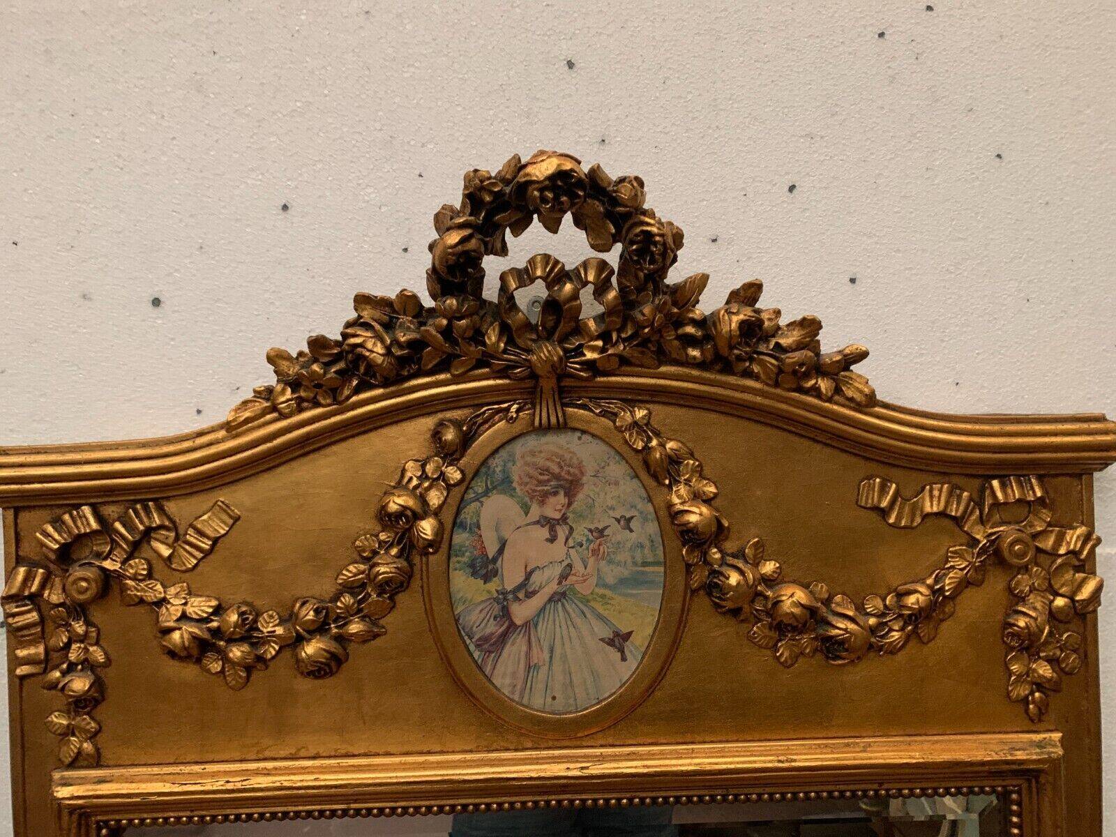 Louis XVI style mirror in wood and gilded stucco 20th century