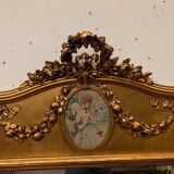 Miroir de style Louis XVI en bois et stuc doré XX siècle