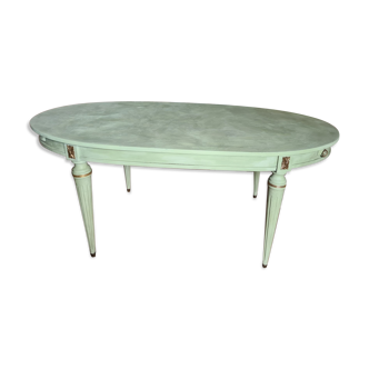 Old oval table with gilding