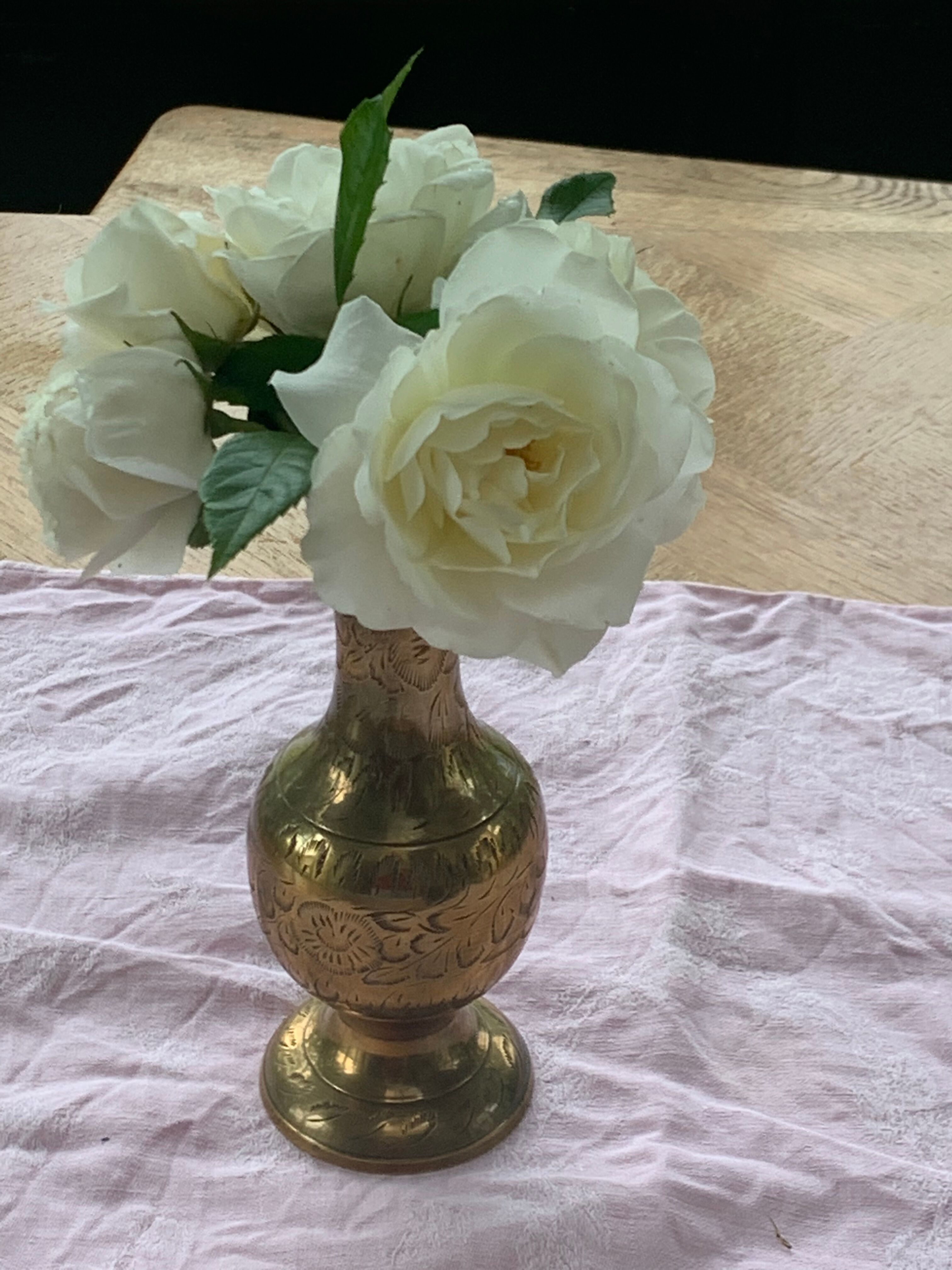 Golden brass vase chiseled vintage floral pattern