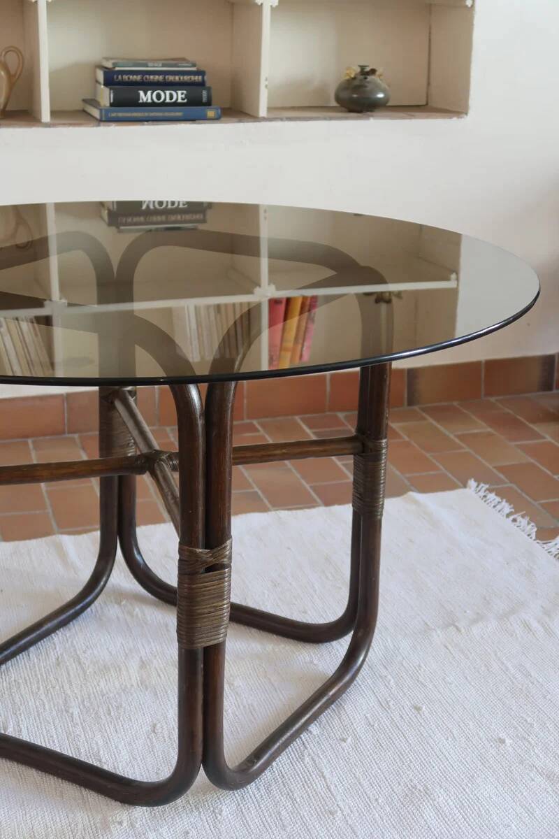 Round dining table in rattan, smoked glass top, 1970s.