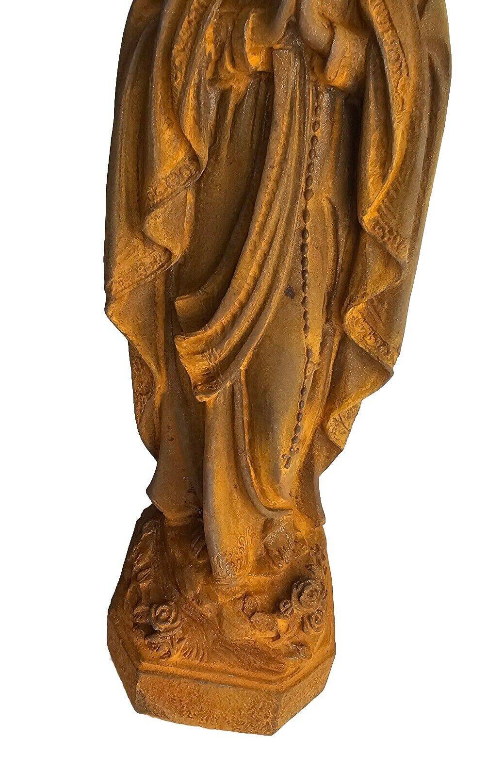 cast iron statue of the virgin