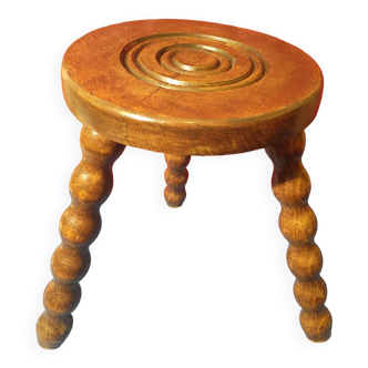 Wooden milking stool with twisted legs