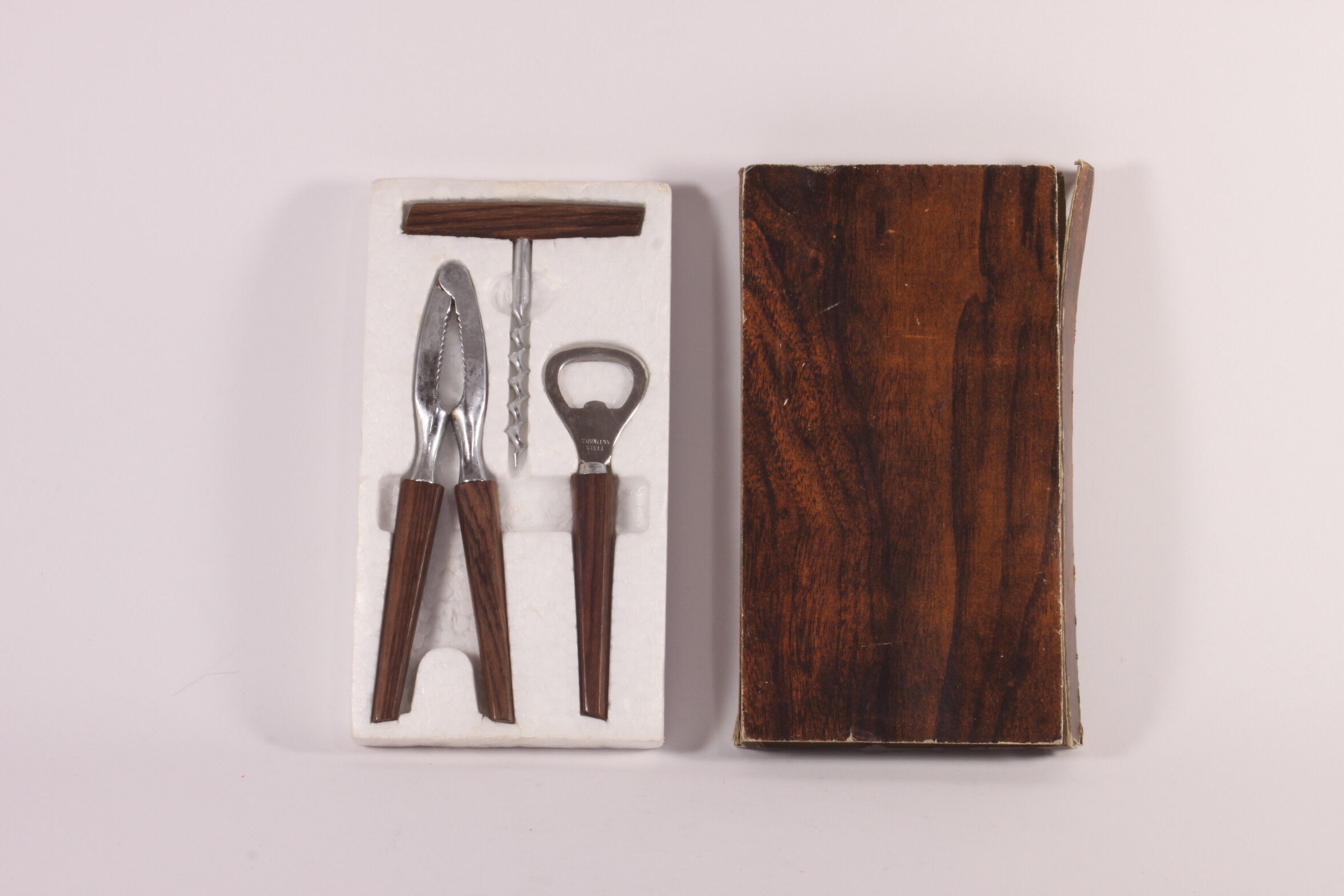 Teak wooden bottle opener, corkscrew and nutcracker set