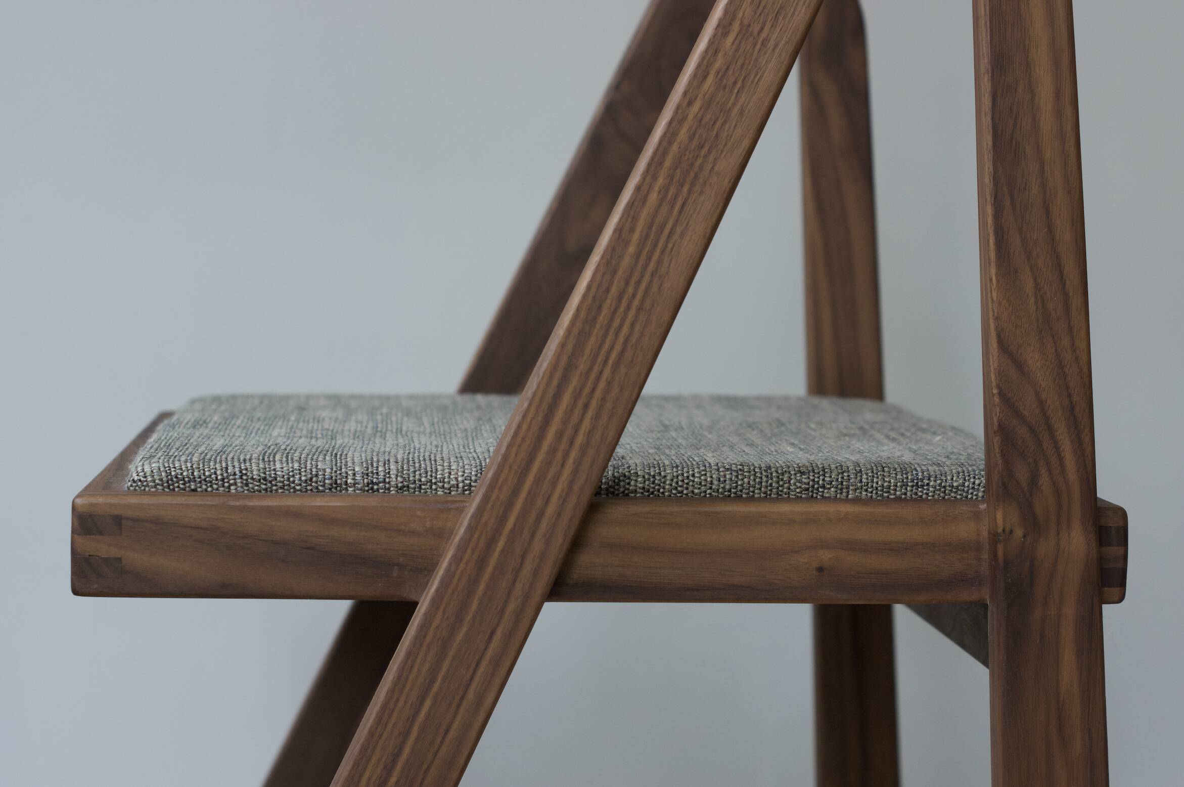 Walnut chair designed by Martin Gillis Studio