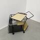 Perforated metal serving trolley in the Mathieu Matégot style