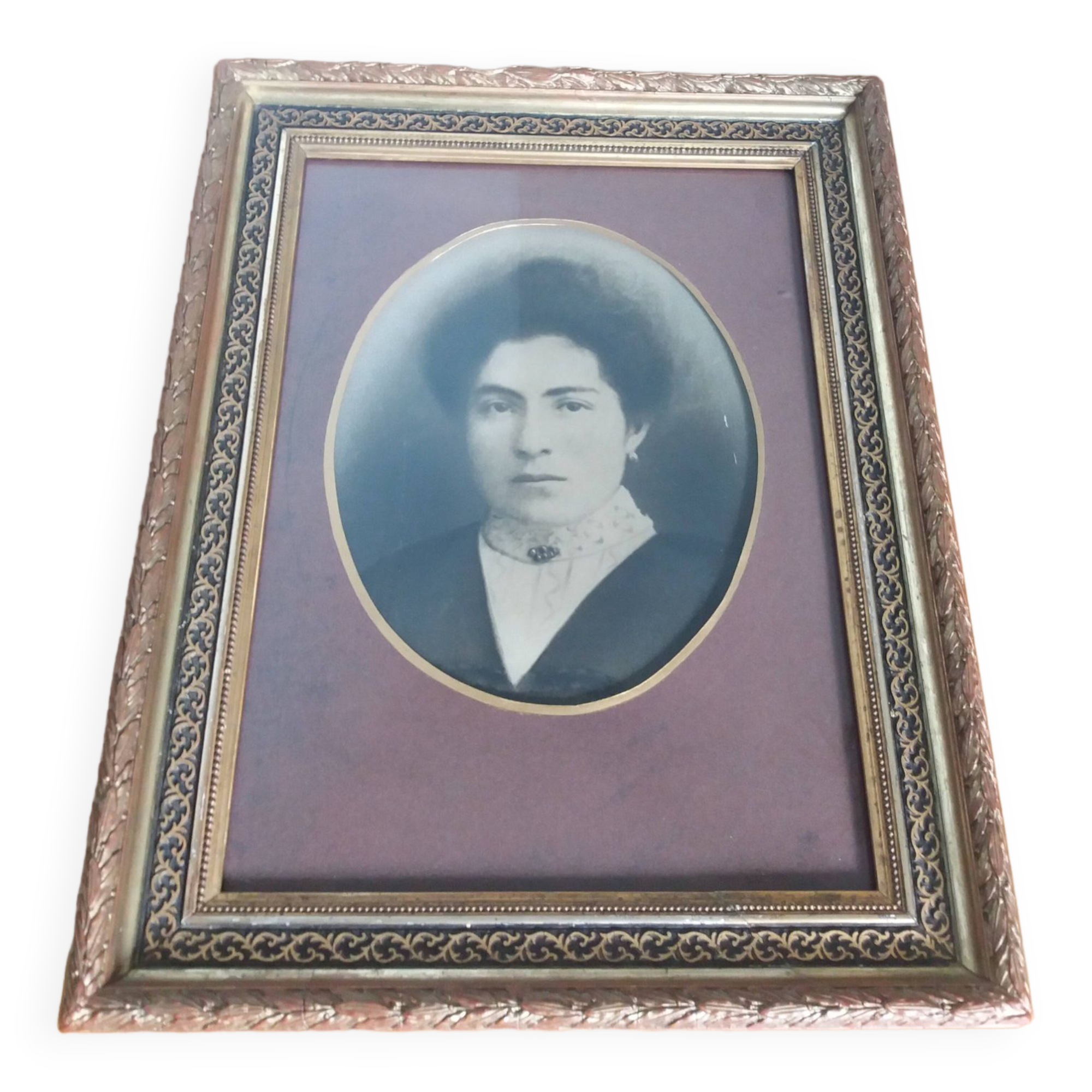 Old photo portrait framed in wood and stucco