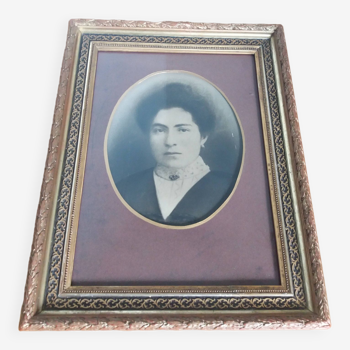 Old photo portrait framed in wood and stucco