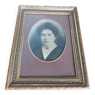 Old photo portrait framed in wood and stucco