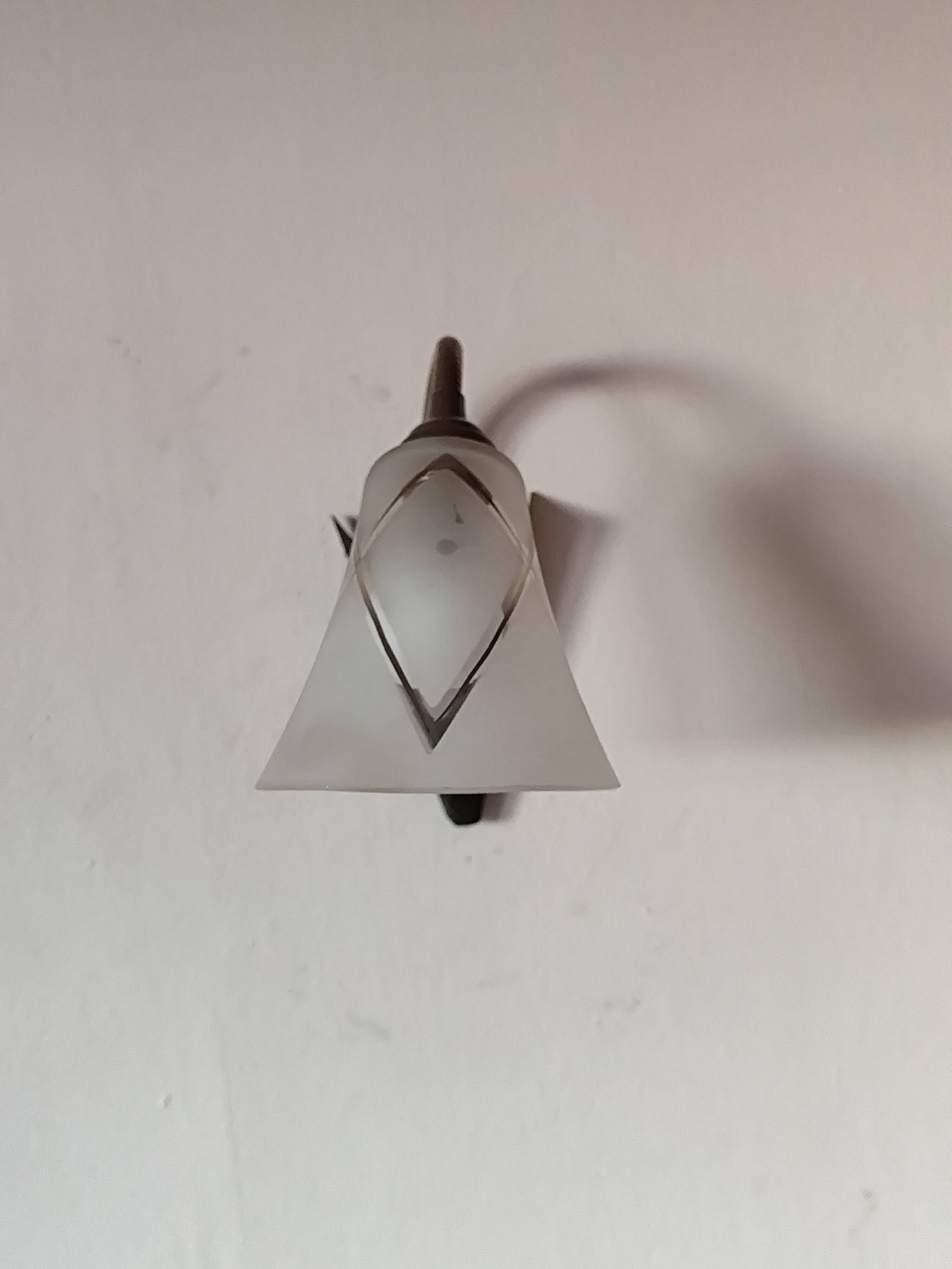 1950s wall lamp, metal, flexible brass stem and opaque shade.