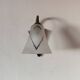 1950s wall lamp, metal, flexible brass stem and opaque shade.