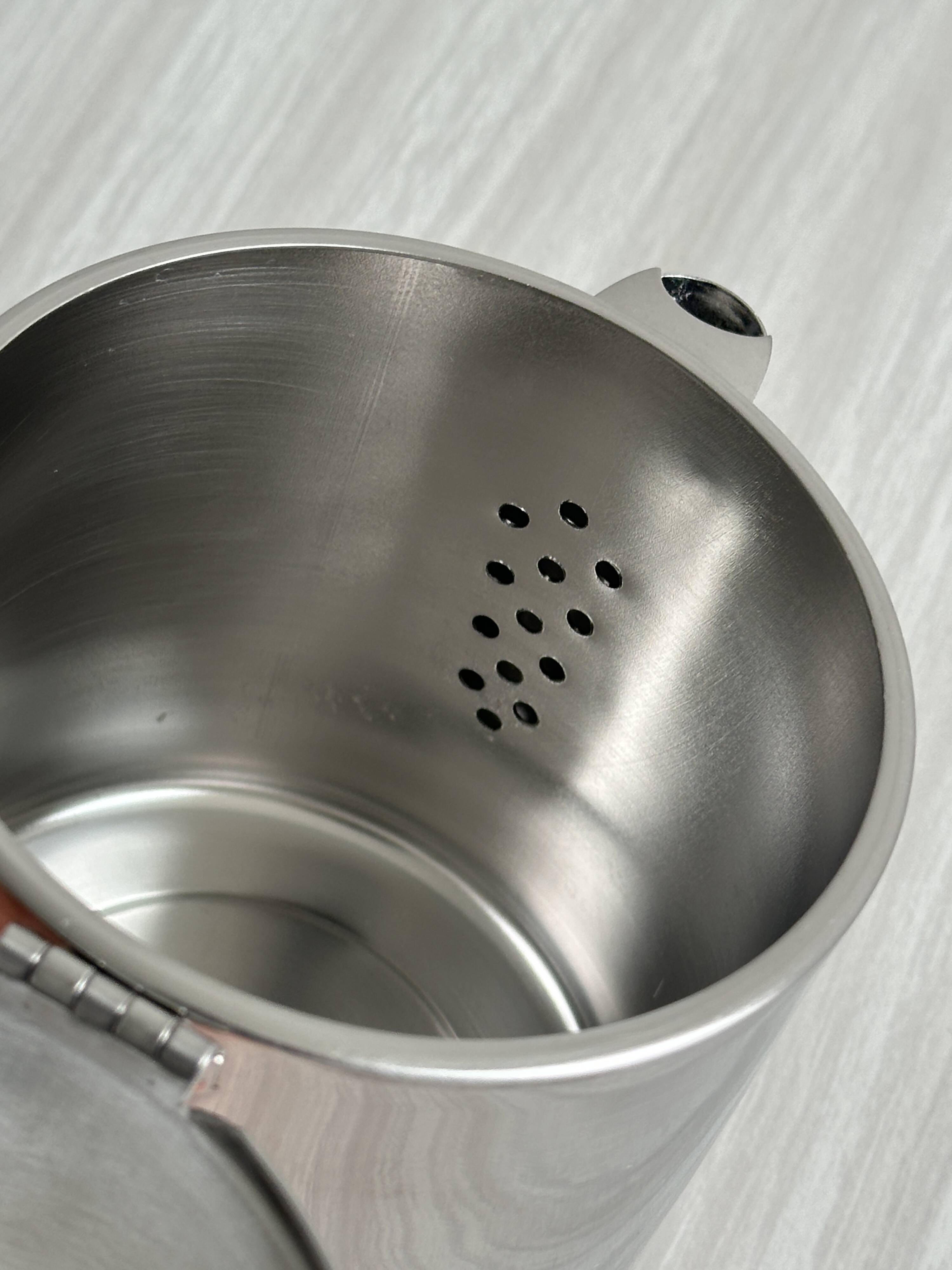 Small shiny stainless steel teapot