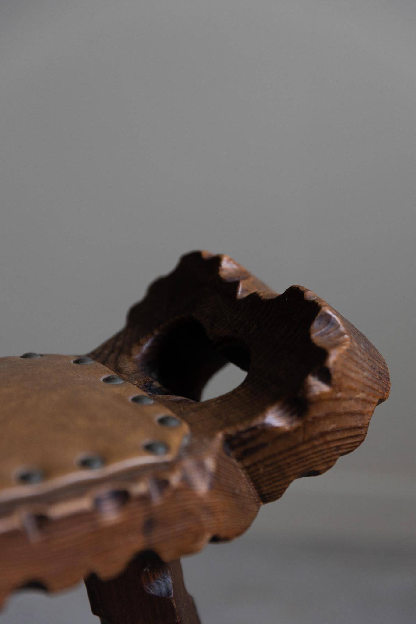 Carved wooden tripod chair with leather seat, Wabi Sabi, early 20th century.