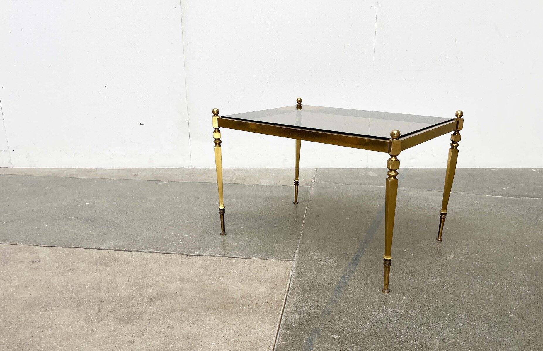 Mid-century German Hollywood neoclassical brass and glass side table from the 1950s.