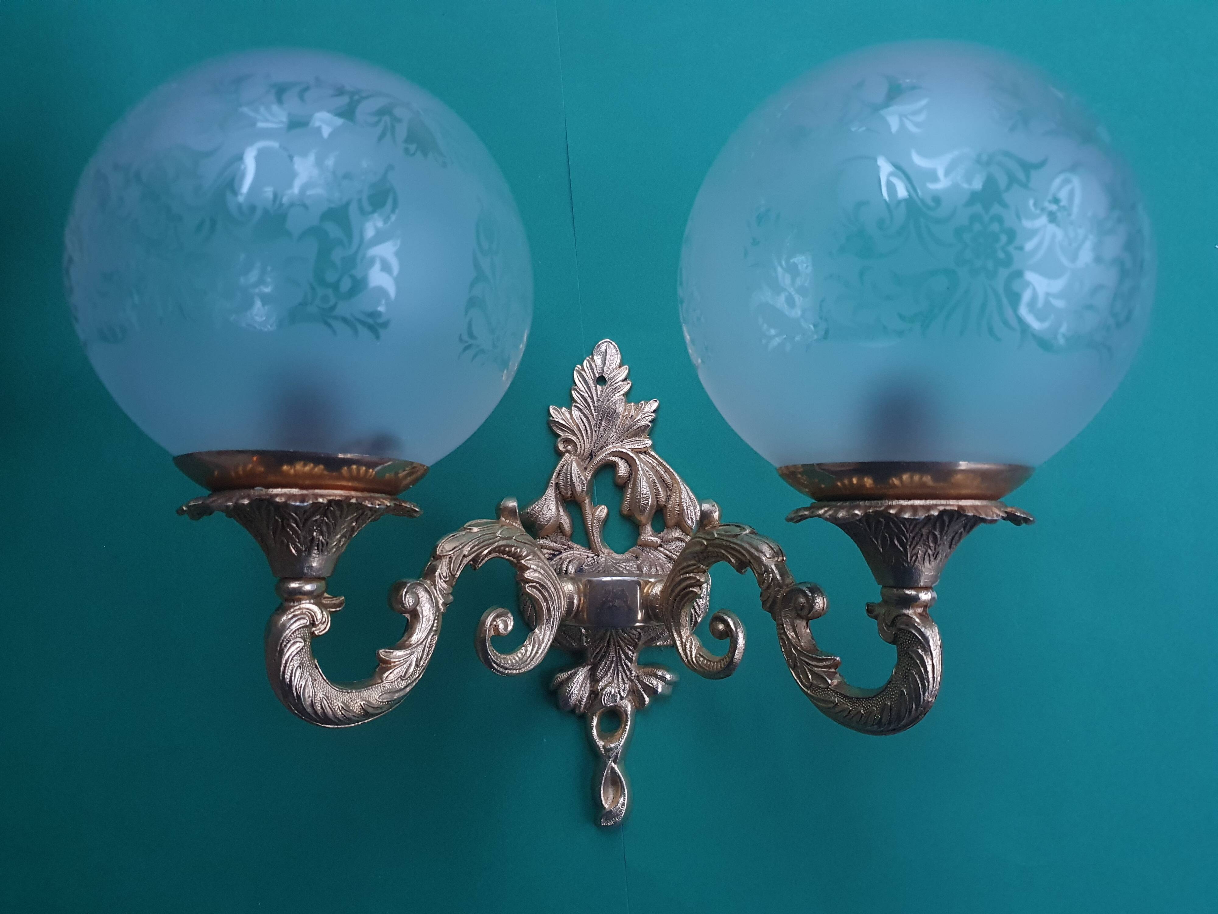 Pair of large double-light wall sconces in vintage brass and glass