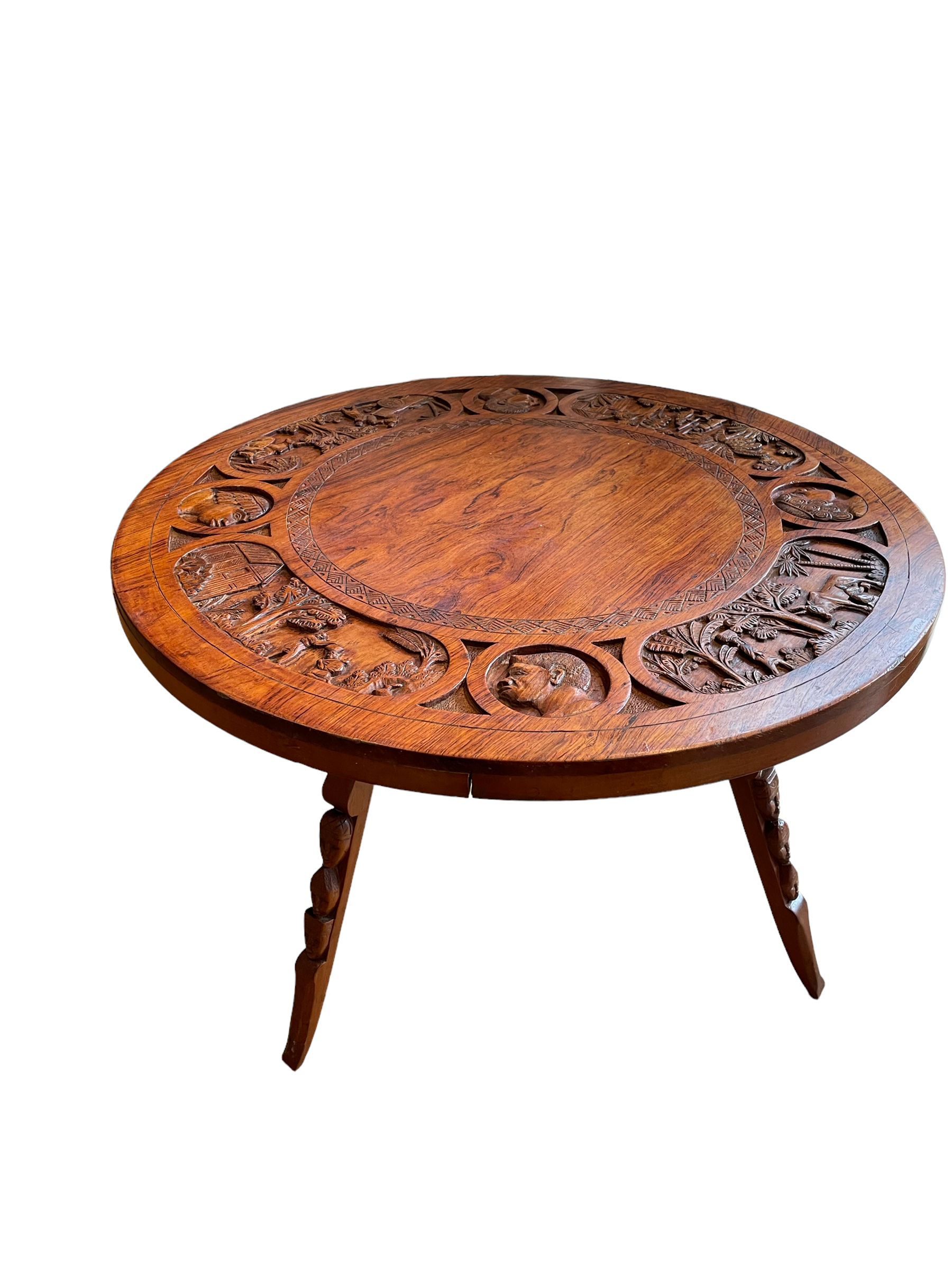Circular tripod coffee table in carved wood