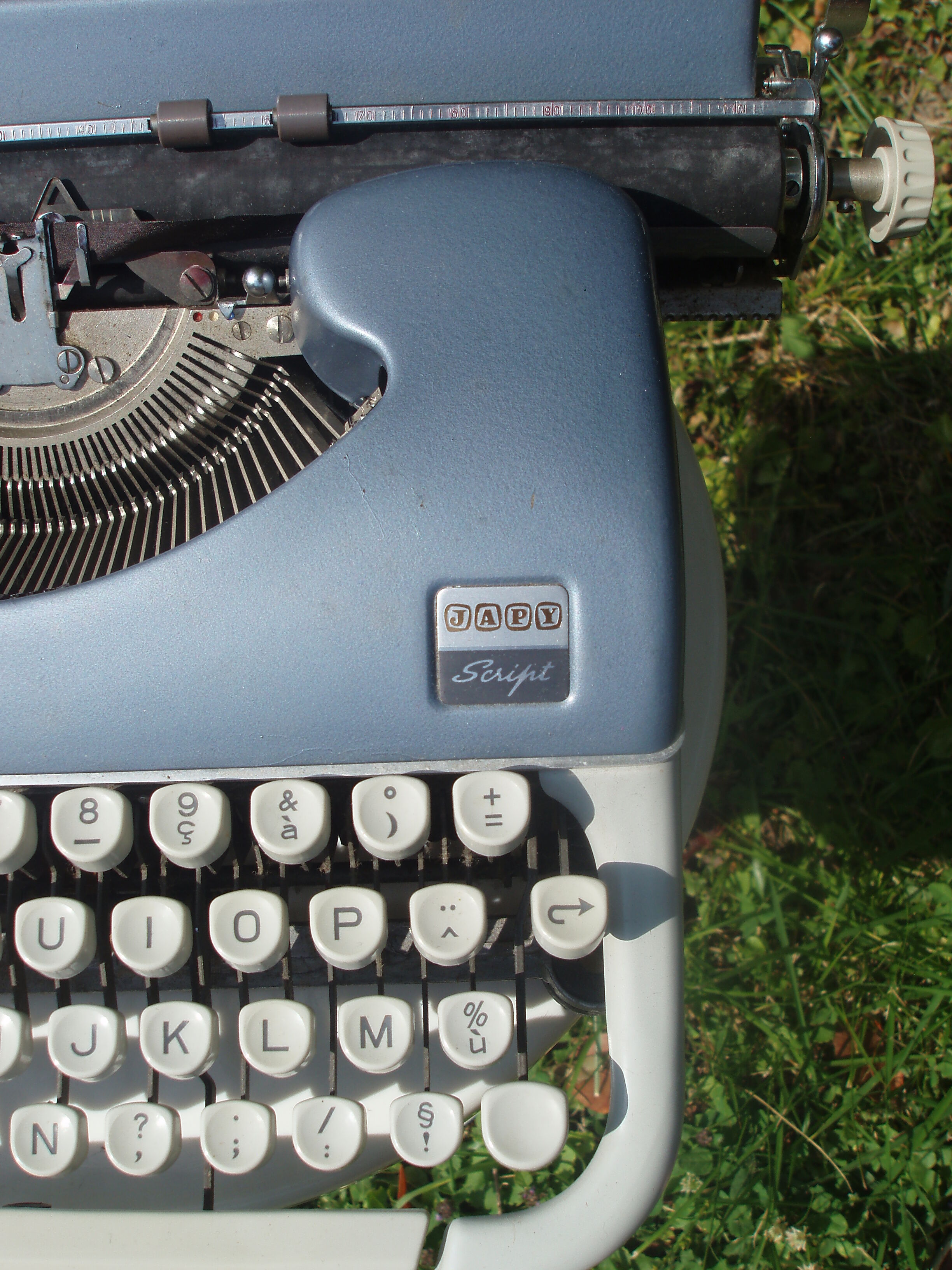 Typewriter blue japy script  with manual and carrying case