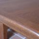 Large solid retractable coffee table