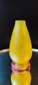 Curved vase made of glass paste