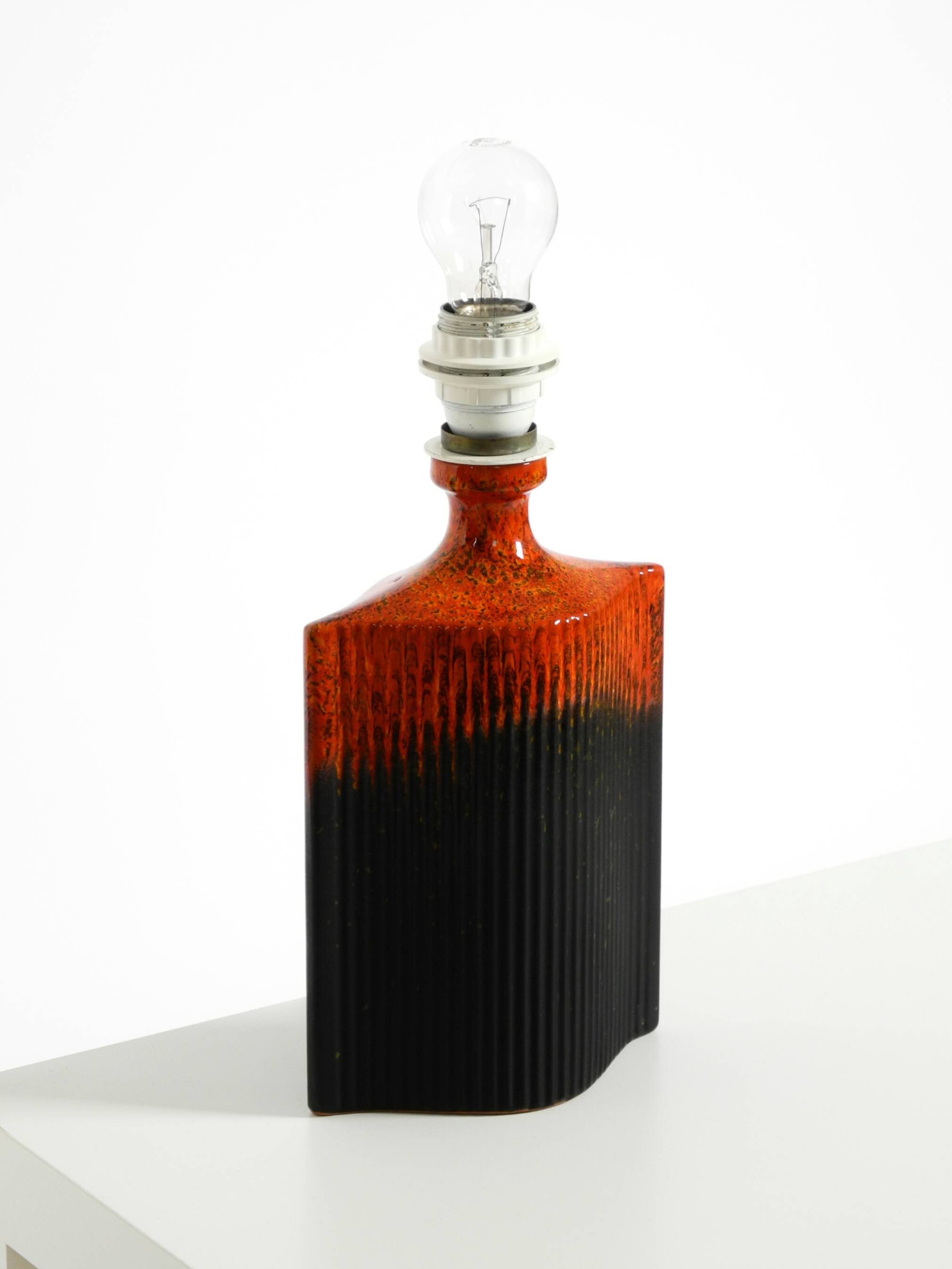 Unique 1960s ceramic table lamp in red and black by Kaiser Leuchten