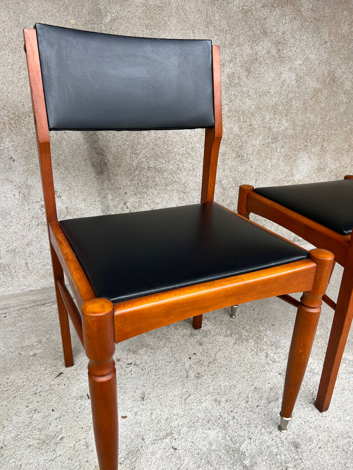 2 wooden and faux leather chairs in Scandinavian style