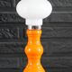 Table lamp or bedside lamp from the 1960s-70s in orange and chrome.
